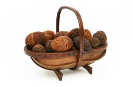 A COLLECTION OF TREEN COQUILLA NUT BOXES AND COVERS 19TH CENTURY the majority of egg shape pomanders