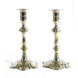 A PAIR OF GEORGE II BRASS CANDLESTICKS IN THE MANNER OF GEORGE GROVE, BIRMINGHAM (FL.1748-1768), C.