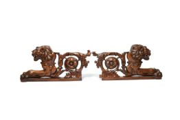 A PAIR OF ITALIAN CARVED WALNUT FRAGMENTS EARLY 19TH CENTURY in the form of a lion's head