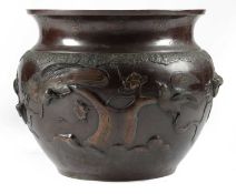 A JAPANESE BRONZE JARDINIERE MEIJI 1868-1912 the rim decorated with lappets, the body with hawks