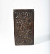 AN ENGLISH RELIEF CARVED OAK ROMAYNE PANEL C.1540 centred with a profile bust portrait of a man