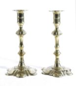 A PAIR OF GEORGE II BRASS CANDLESTICKS IN THE MANNER OF GEORGE GROVE, BIRMINGHAM (FL.1748-1768), C.