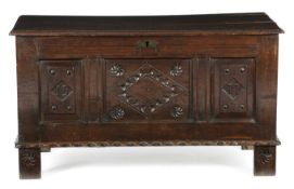 AN OAK COFFER LANCASHIRE, DATED '1577' with broad run moulding to top and muntin rails, with a