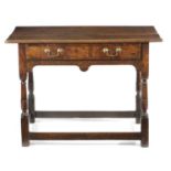 AN EARLY GEORGE II OAK SIDE TABLE C.1730 having a triple plank top with a rounded edge, the