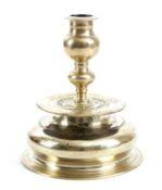 A GERMAN BRASS BELL-BASE CANDLESTICK MAKER MARKED, NUREMBERG, C.1590 the cast bulbous-knop stem