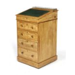 A VICTORIAN SATIN BIRCH DAVENPORT BY C. HINDLEY & SONS, C.1860-70 the swivel top with a brass