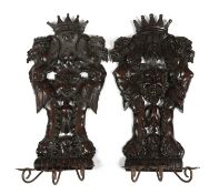 A PAIR OF ITALIAN WALNUT APPLIQUES IN RENAISSANCE STYLE, 19TH CENTURY each carved with a mask