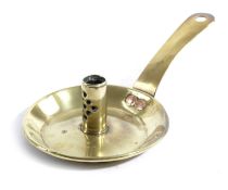 A BRASS CHAMBERSTICK C.1710-40 the circular pan with a rolled edge, the cylindrical socket with