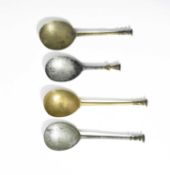 FOUR LATTEN SPOONS 16TH CENTURY each with a gadrooned baluster seal top, with worn maker's marks (4)