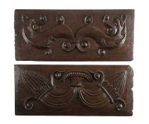 A PAIR OF ELIZABETH I OAK PANELS C.1580 one carved with a Wyvern, the other with budding foliage (2)