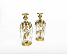 A PAIR OF REGENCY GILT BRASS LUSTRES C.1820 with an ostrich and a stork support, each with ten cut