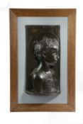 A BRONZE RELIEF PORTRAIT BUST OF THE YOUNG ST. JOHN THE BAPTIST AFTER DESIDERIO DA SETTIGNANO, (