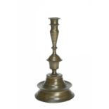 A TUDOR BRONZE 'CHALICE AND PATEN' CANDLESTICK SECOND HALF 16TH CENTURY LATER with a wide fillet