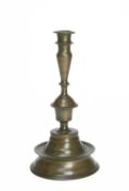 A TUDOR BRONZE 'CHALICE AND PATEN' CANDLESTICK SECOND HALF 16TH CENTURY LATER with a wide fillet
