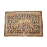 A NORTH WEST PERSIAN SADDLE RUG EARLY 20TH CENTURY the indigo Herati field, enclosed by triple