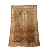 A WEST PERSIAN VILLAGE PRAYER RUG C.1920 the camel field with a stylised tree of life, flanked by