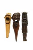 A BLACK FOREST LEVER ACTION TREEN NUTCRACKER EARLY 20TH CENTURY carved as a man in 17th century
