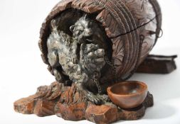 A BLACK FOREST LINDEN WOOD BARREL CASKET LATE 19TH CENTURY the rope bound barrel with two chained