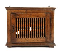 A FRENCH PROVINCIAL CHESTNUT MURAL DOLE CUPBOARD LATE 18TH / EARLY 19TH CENTURY with a hinged turned