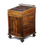 λ A WILLIAM IV ROSEWOOD DAVENPORT IN THE MANNER OF GILLOWS, C.1835 the sliding top with a spindle