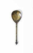 A SMALL ELIZABETH I LATTEN SPOON C.1570 with an acorn finial above an hexagonal stem, the fig shaped