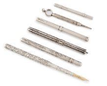 A collection of silver dip pens and pencils, including: an unmarked dip pen, possibly American circa