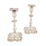 A pair of George II silver candlesticks, by John Cafe, London 1755, knopped baluster form with