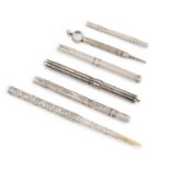 A collection of silver dip pens and pencils, including: an unmarked dip pen, possibly American circa