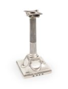 A George III silver taperstick, by Makepeace and Carter, London 1777, fluted Ionic column, beaded