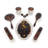 A matched silver-mounted tortoiseshell dressing table set, mainly by Mappin & Webb, London 1922,
