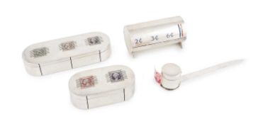 A collection of American silver stamp dispensers, comprising: one by Shreve, Crump, & Low Co Inc.,