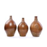THREE MASSIVE GERMAN STONEWARE BARTMANN OR BELLARMINE JUGS 17TH/18TH CENTURY all with moulded