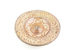 A HISPANO MORESQUE CHARGER VALENCIA (MANISES), LATE 16TH CENTURY in pale copper lustre, the centre