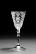 A NEWCASTLE LIGHT BALUSTER WINE GLASS PROBABLY DUTCH DECORATED, C.1740 the funnel bowl engraved with