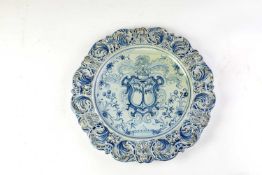 A LARGE SAVONA FAIENCE ARMORIAL BLUE AND WHITE DISH 18TH CENTURY the centre painted with a large