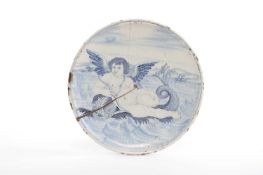 AN ITALIAN MAIOLICA TAZZA EARLY 18TH CENTURY blue painted in the Renaissance style with a cherub