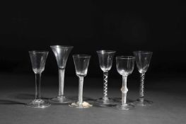 SIX SMALL WINE GLASSES C.1750 AND LATER comprising: one with a drawn trumpet bowl on an air twist