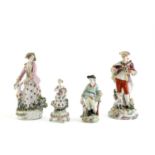 TWO DERBY FIGURES C.1760-70 he standing holding a basket of fruit and flowers, she with a hound at