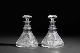 A PAIR OF GLASS SHIP'S DECANTERS AND STOPPERS C.1800 each cut with horizontal bands around an oval