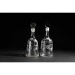 TWO ENGRAVED GLASS DECANTERS AND STOPPERS C.1765 each of sugarloaf form with a faceted stopper,