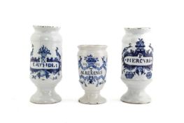 THREE DELFTWARE BLUE AND WHITE DRUG JARS DUTCH, MID-18TH CENTURY the cylindrical bodies inscribed 'T