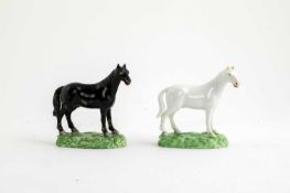 TWO BLOOR DERBY MODELS OF HORSES C.1820 one white, the other black, both raised on green moulded