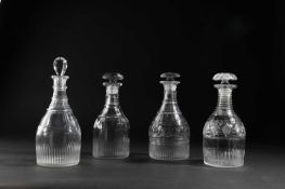 FOUR REGENCY GLASS DECANTERS AND STOPPERS EARLY 19TH CENTURY each of Prussian form cut with