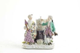 A MEISSEN 'LOVERS AND BIRDCAGE' GROUP MID-18TH CENTURY modelled with a young man offering flowers to