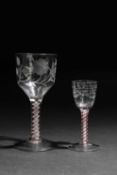TWO CONTINENTAL COLOUR TWIST WINE GLASSES 18TH CENTURY one with a large ogee bowl engraved with