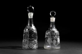 TWO ENGRAVED GLASS DECANTERS AND STOPPERS C.1765 each of sugarloaf form with a faceted stopper,