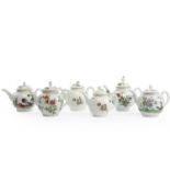 A COLLECTION OF FIVE WORCESTER TEAPOTS AND COVERS C.1770 comprising: one painted with a