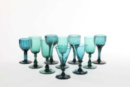 THREE GREEN GLASS WINE GLASSES 19TH CENTURY each with ogee bowls with facet cut bases and stems