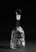 AN ENGRAVED GLASS DECANTER AND STOPPER C.1765 of sugarloaf form with a facted stopper, engraved '