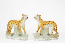 A RARE PAIR OF STAFFORDSHIRE LEOPARDS MID-19TH CENTURY each modelled walking and decorated in